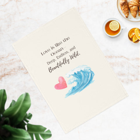 Love is like the ocean - deep, endless, and beautifully wild. Organic cotton tea towel with romantic beach vibes.