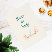 Seas the day - vibrant eco-friendly organic cotton tea towel with coastal charm and a daily dose of beachy motivation.