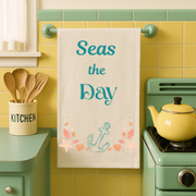 Seas the day - vibrant eco-friendly organic cotton tea towel with coastal charm and a daily dose of beachy motivation.